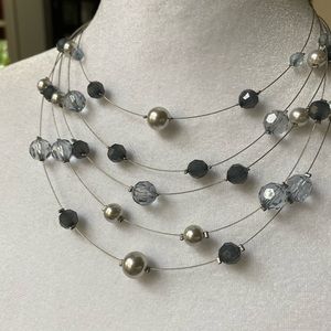 Blue/gray beads on wire necklace.  Perfect condition. Adjustable